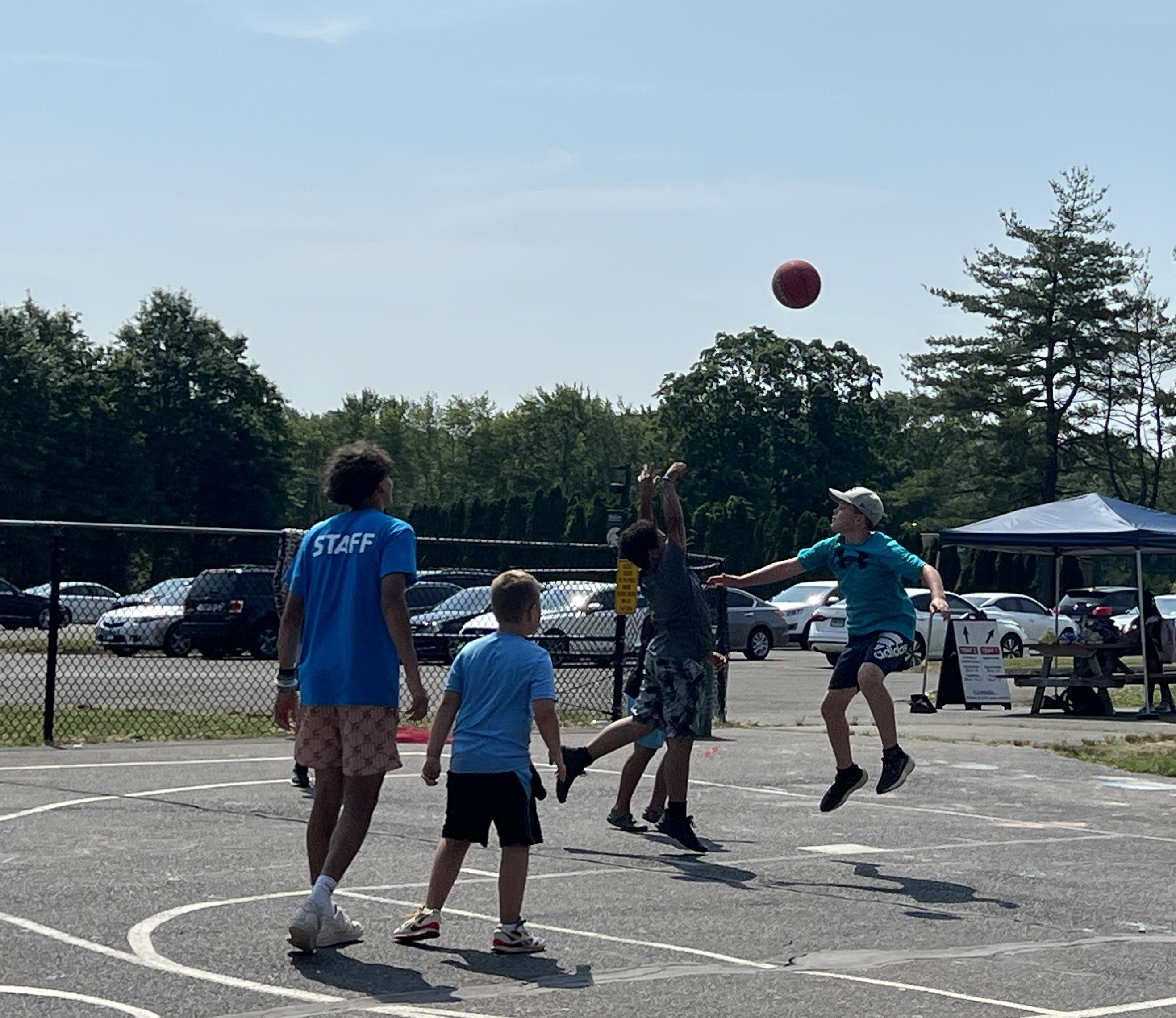Camp Thundermoon sports campers playing basketball